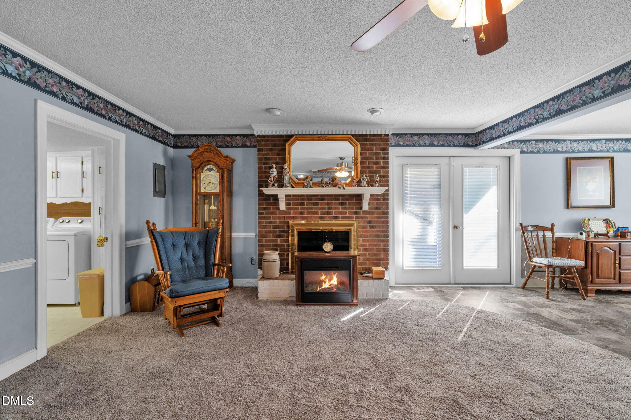 401 Allens Crossroads Road Four Oaks, NC 27524 - Photo 8 of 64 a living room with furniture and a fireplace