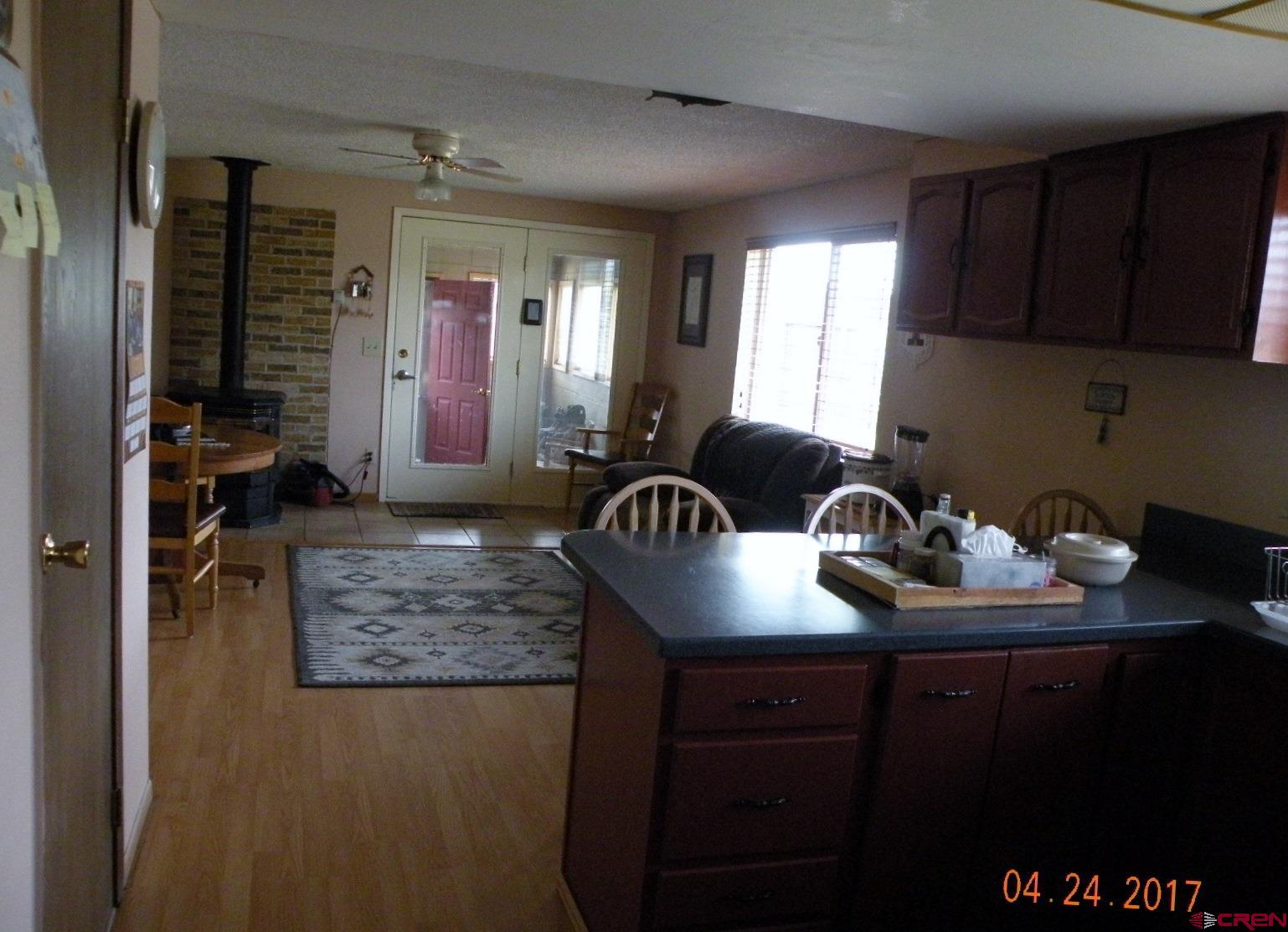 30146 DD31 Road Nucla, CO 81424 - Photo 15 of 25 a kitchen with sink refrigerator and cabinets