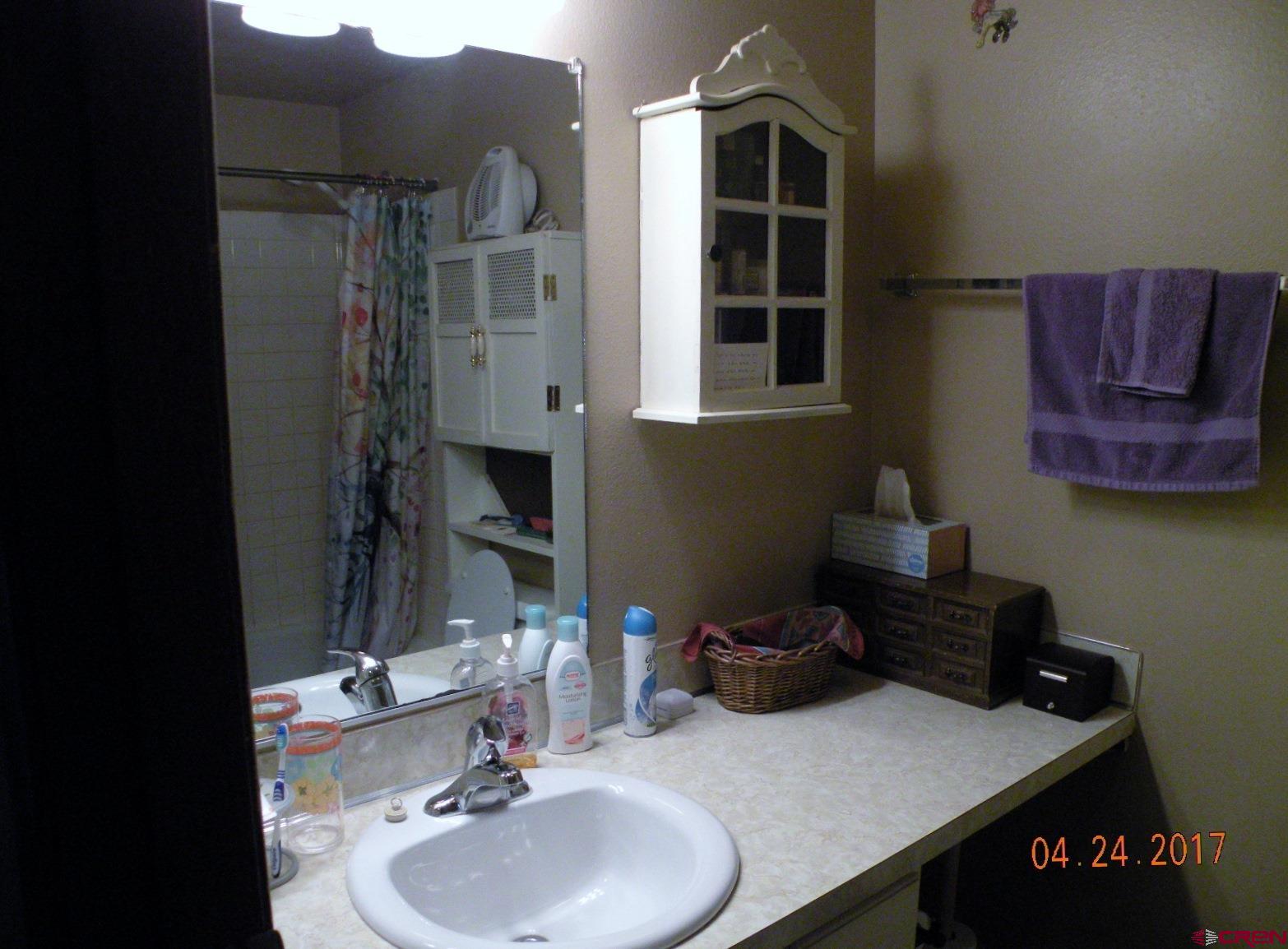 30146 DD31 Road Nucla, CO 81424 - Photo 21 of 25 a bathroom with a sink and a mirror