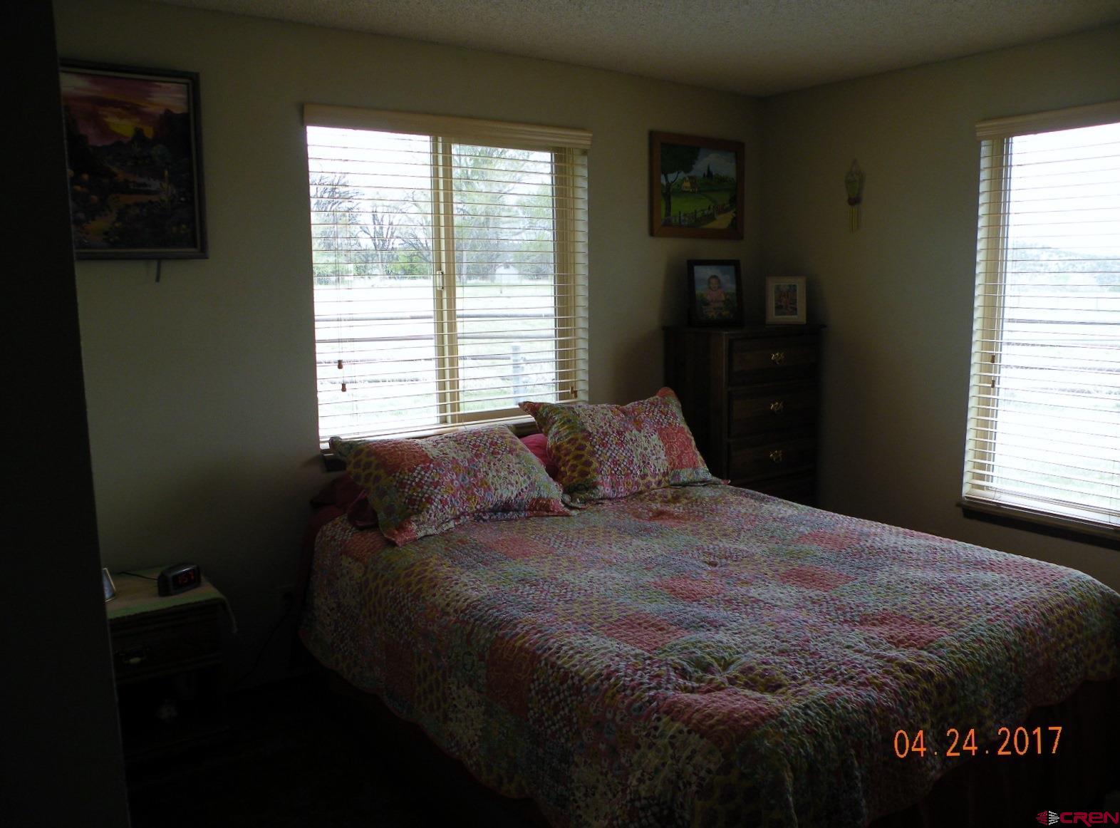 30146 DD31 Road Nucla, CO 81424 - Photo 25 of 25 a bed sitting in a bedroom next to a window