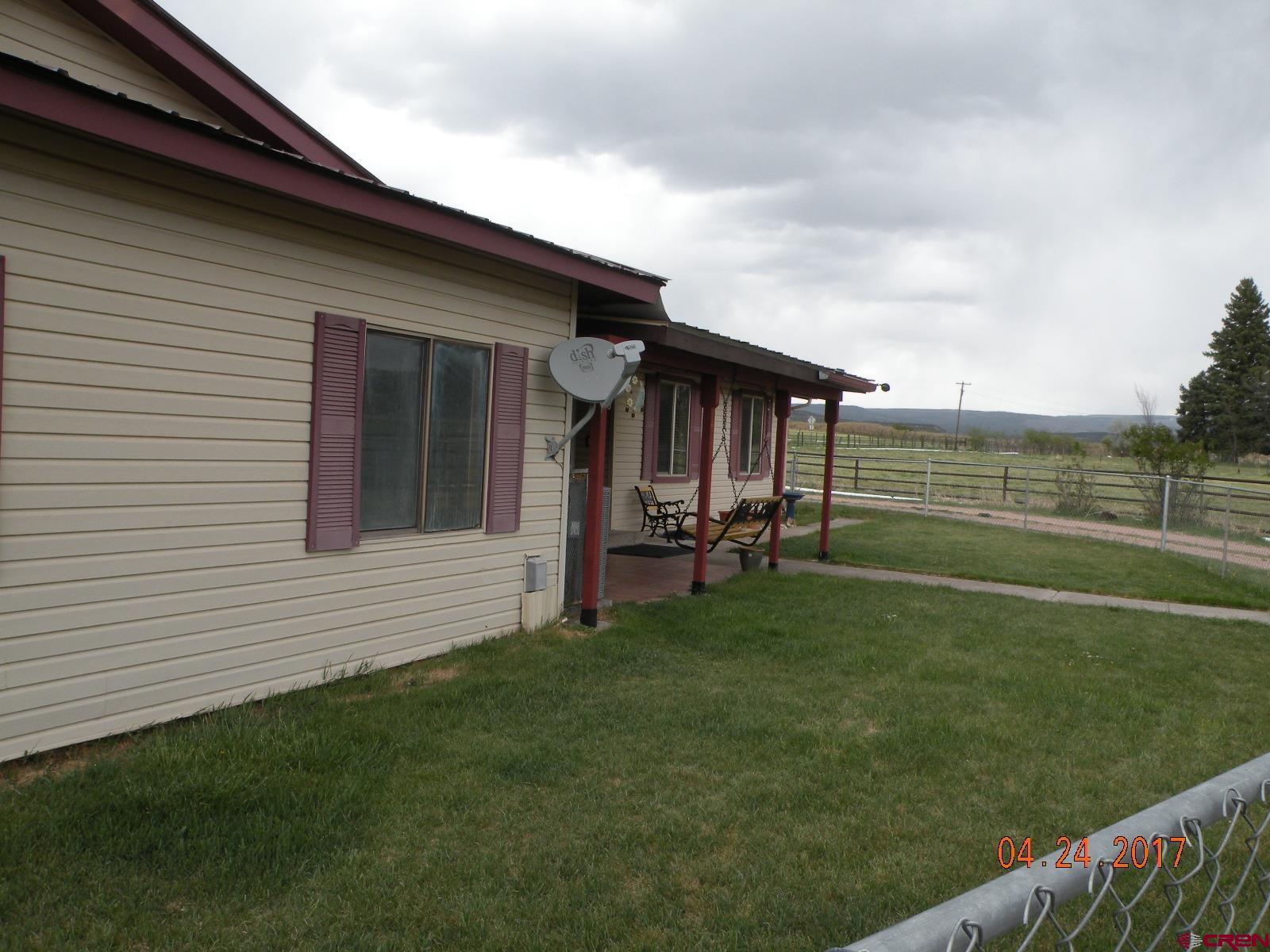 30146 DD31 Road Nucla, CO 81424 - Photo 3 of 25 a view of backyard with hardwood and deck