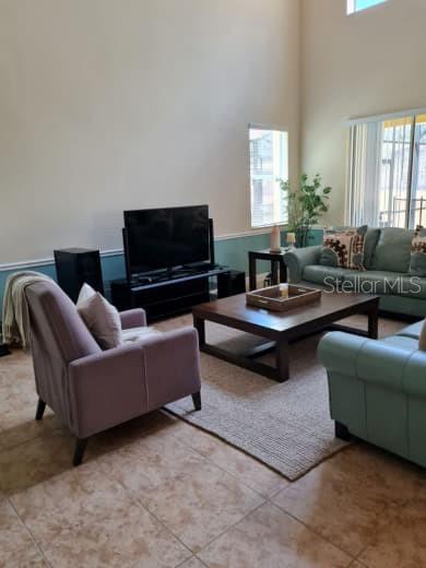 8923 Cuban Palm Road Kissimmee, FL 34747 - Photo 14 of 87 a living room with furniture and a flat screen tv