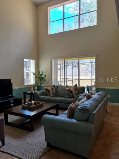 8923 Cuban Palm Road Kissimmee, FL 34747 - Photo 17 of 87 a living room with furniture and a window