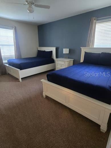 8923 Cuban Palm Road Kissimmee, FL 34747 - Photo 31 of 87 a living room with furniture and a window