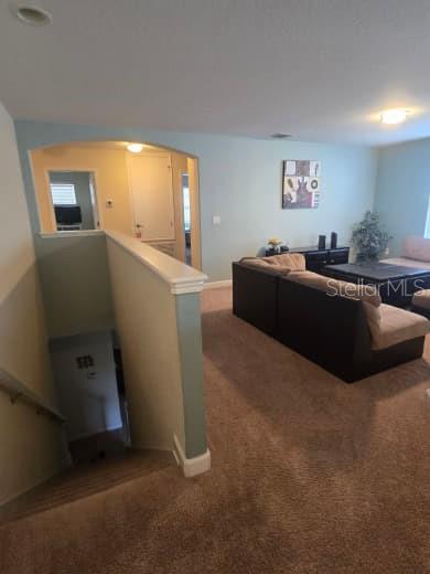 8923 Cuban Palm Road Kissimmee, FL 34747 - Photo 35 of 87 a living room with furniture and a flat screen tv