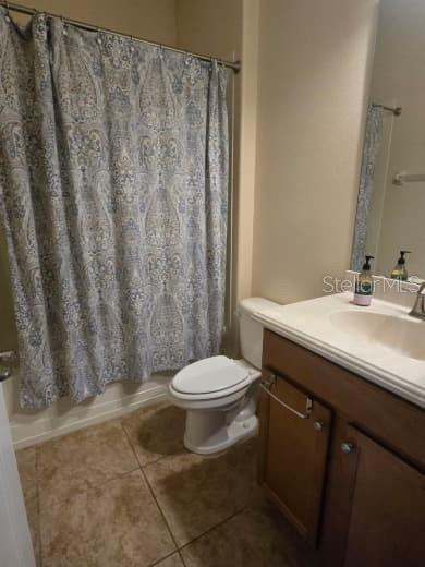 8923 Cuban Palm Road Kissimmee, FL 34747 - Photo 38 of 87 a bathroom with a sink a toilet and shower