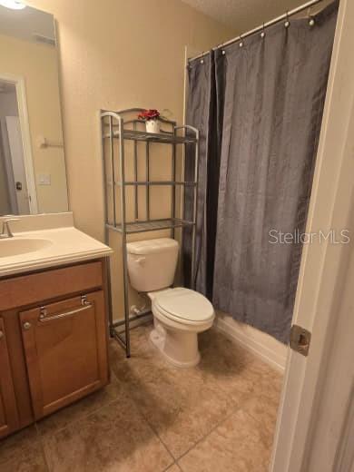 8923 Cuban Palm Road Kissimmee, FL 34747 - Photo 39 of 87 a bathroom with a sink a toilet a mirror and shower