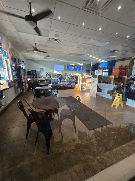 8923 Cuban Palm Road Kissimmee, FL 34747 - Photo 52 of 87 a living room with lots of furniture and a chandelier