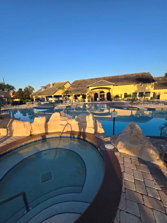 8923 Cuban Palm Road Kissimmee, FL 34747 - Photo 66 of 87 a view of a swimming pool and an ocean view