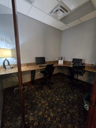 8923 Cuban Palm Road Kissimmee, FL 34747 - Photo 82 of 87 a room with chairs wooden floor and a ceiling fan