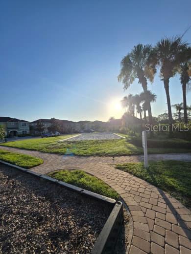 8923 Cuban Palm Road Kissimmee, FL 34747 - Photo 83 of 87 a view of a lake with a house in the background