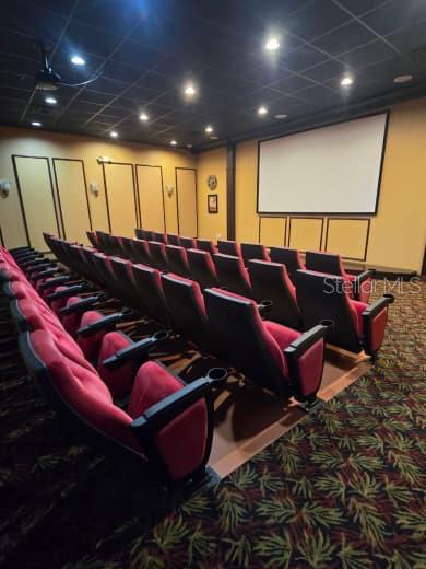 8923 Cuban Palm Road Kissimmee, FL 34747 - Photo 84 of 87 a media room with lots of chairs and a projector screen