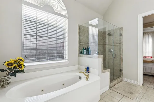 a white bath tub sitting next to a white sink