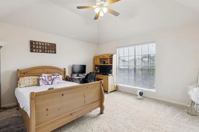 a bedroom with furniture and windows