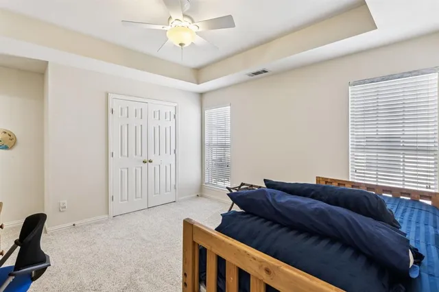 a bedroom with bed and window