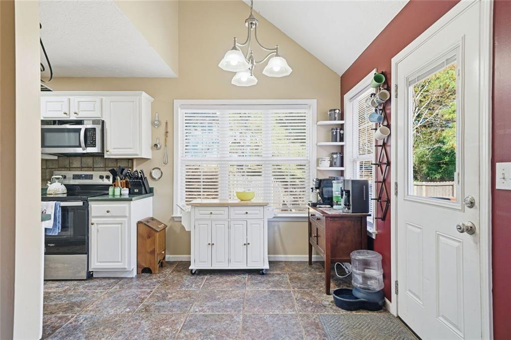 137 Orchard Way Southeast Calhoun, GA 30701 - Photo 11 of 37 a view of a kitchen with microwave and windows