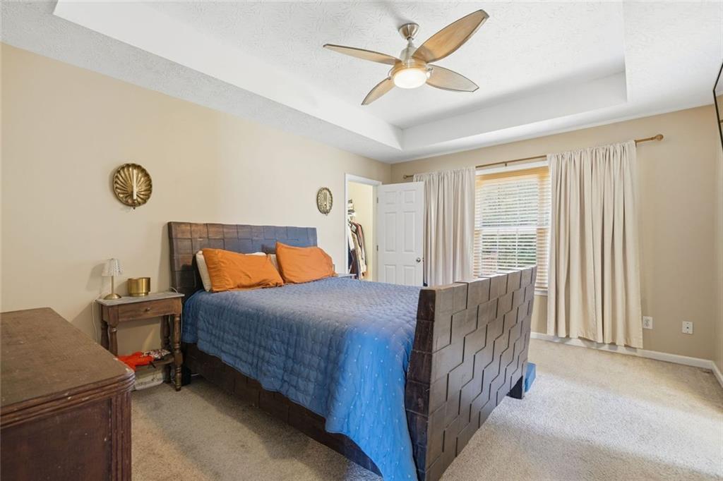 137 Orchard Way Southeast Calhoun, GA 30701 - Photo 13 of 37 a bedroom with a bed and a window