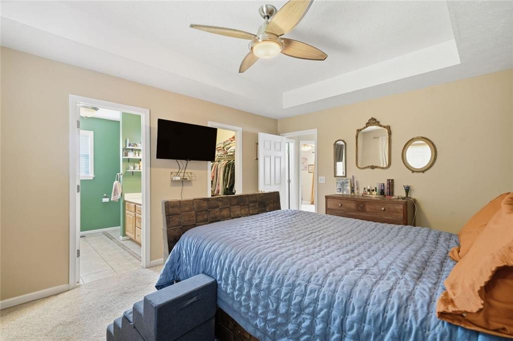 137 Orchard Way Southeast Calhoun, GA 30701 - Photo 14 of 37 a bedroom with a bed and a flat screen tv