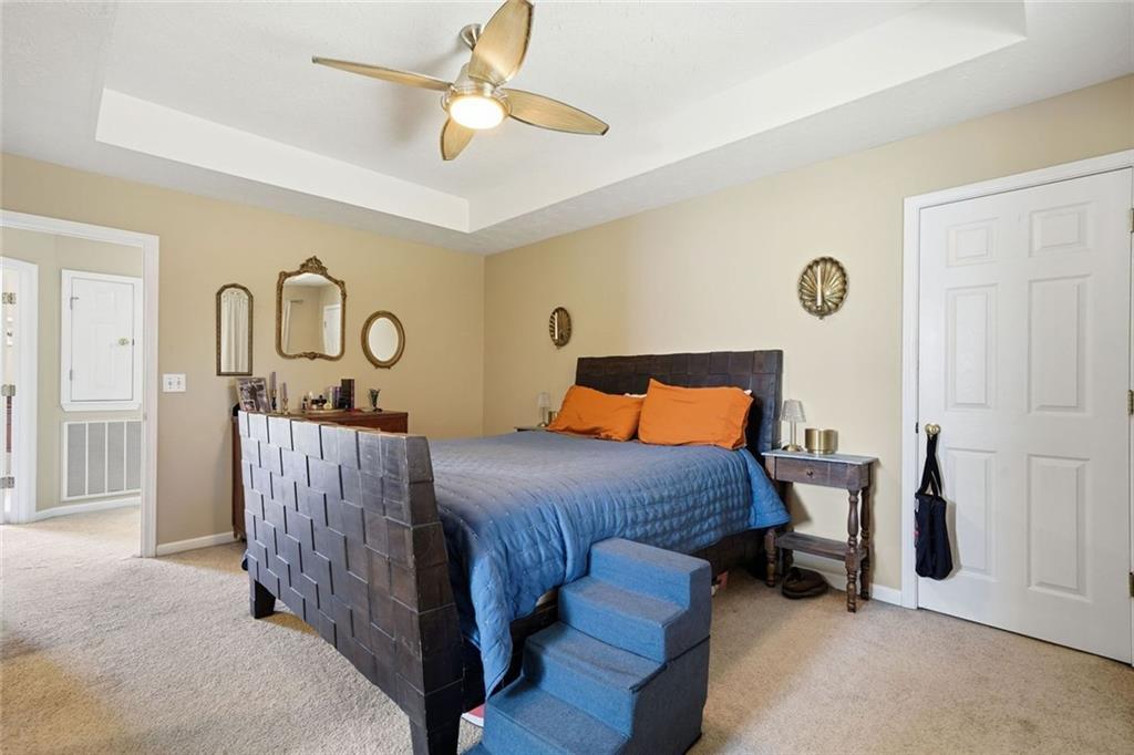 137 Orchard Way Southeast Calhoun, GA 30701 - Photo 15 of 37 a bedroom with a bed and ceiling fan
