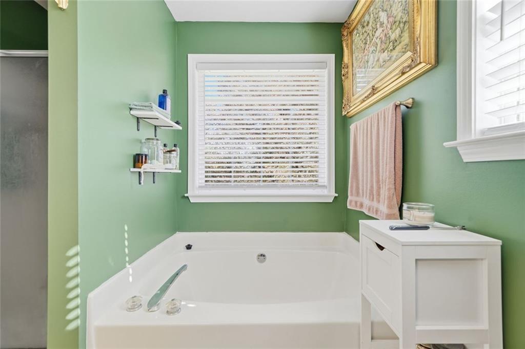 137 Orchard Way Southeast Calhoun, GA 30701 - Photo 17 of 37 a bathroom with a bathtub and a window
