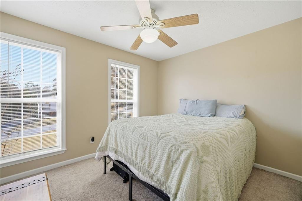 137 Orchard Way Southeast Calhoun, GA 30701 - Photo 18 of 37 a bedroom with a bed and a window