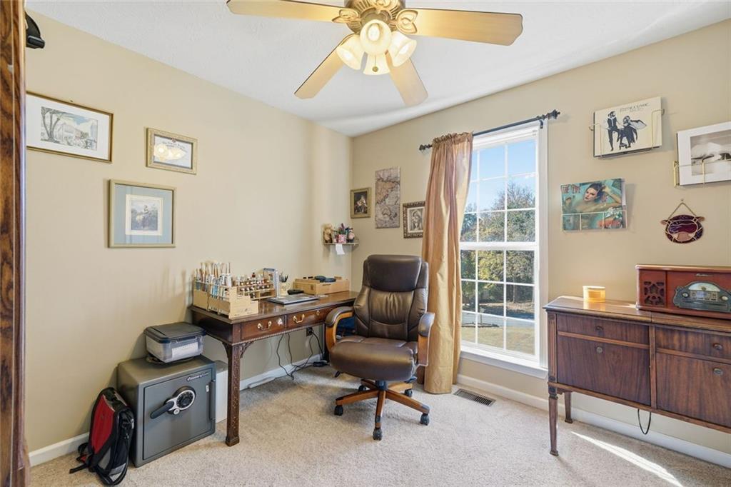 137 Orchard Way Southeast Calhoun, GA 30701 - Photo 20 of 37 a view of a workspace with furniture and a window