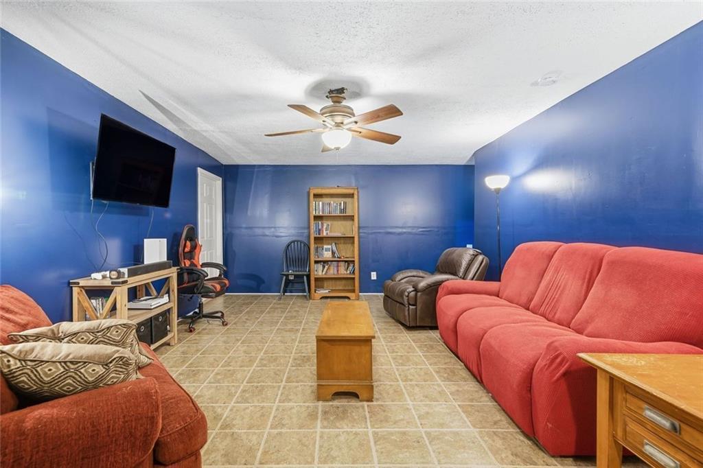 137 Orchard Way Southeast Calhoun, GA 30701 - Photo 24 of 37 a projector room with furniture and a flat screen tv