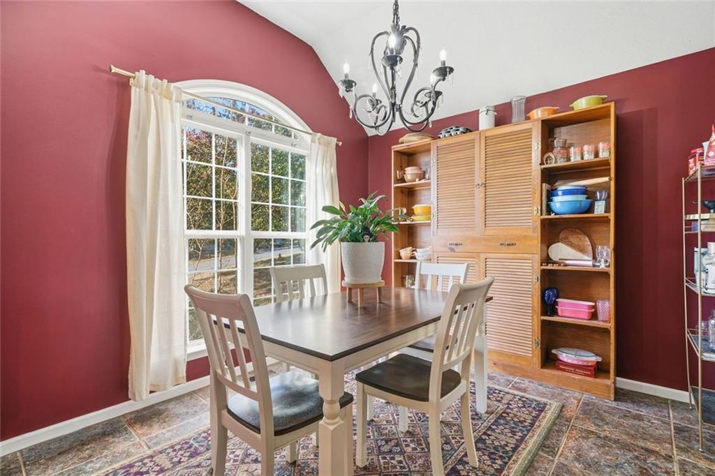 137 Orchard Way Southeast Calhoun, GA 30701 - Photo 9 of 37 a view of a dining room with furniture and a chandelier