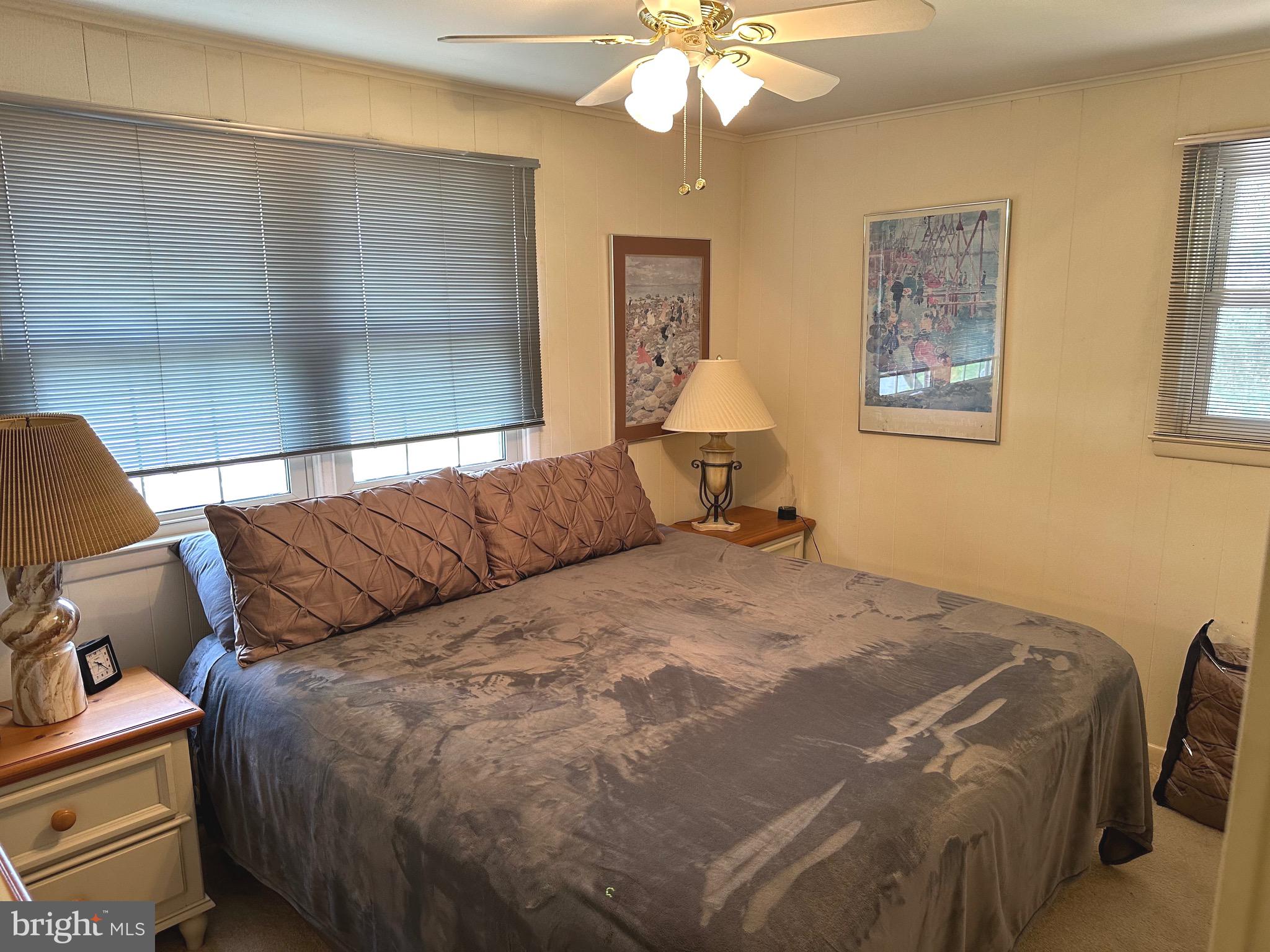 901 Kingston Drive Cherry Hill, NJ 08034 - Photo 22 of 30 a bedroom with a bed and a chandelier