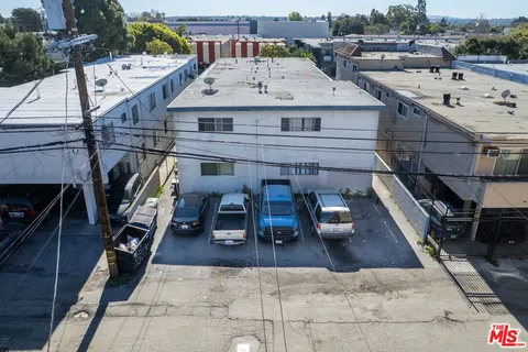 an aerial view of a house with entertaining space