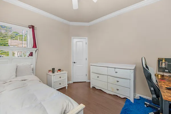 a bedroom with a bed and a dresser