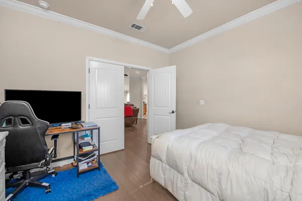 a bedroom with a workspace