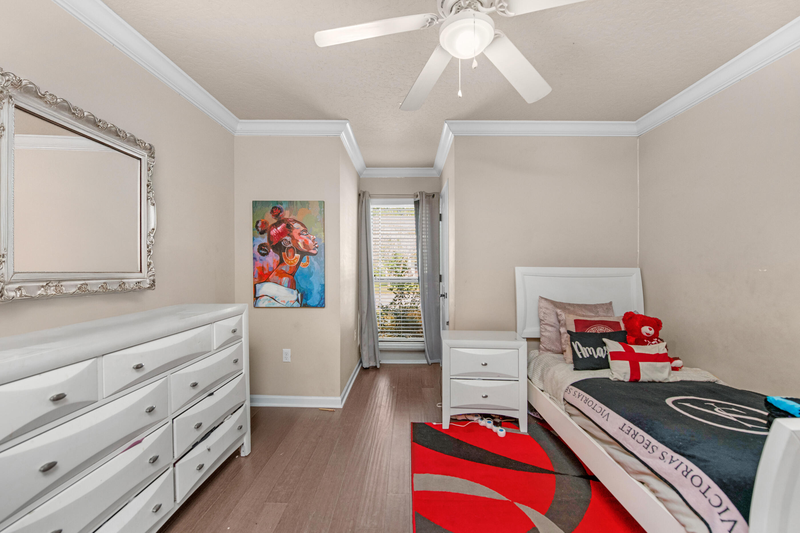 4537 Annabelle Lane Crestview, FL 32539 - Photo 21 of 41 a living room with furniture and a dresser