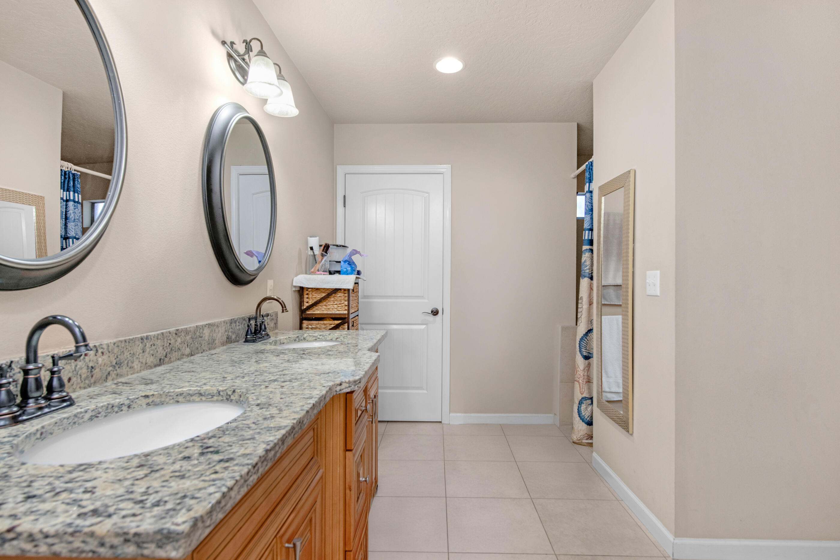 4537 Annabelle Lane Crestview, FL 32539 - Photo 29 of 41 a bathroom with a granite countertop double vanity sink and a mirror