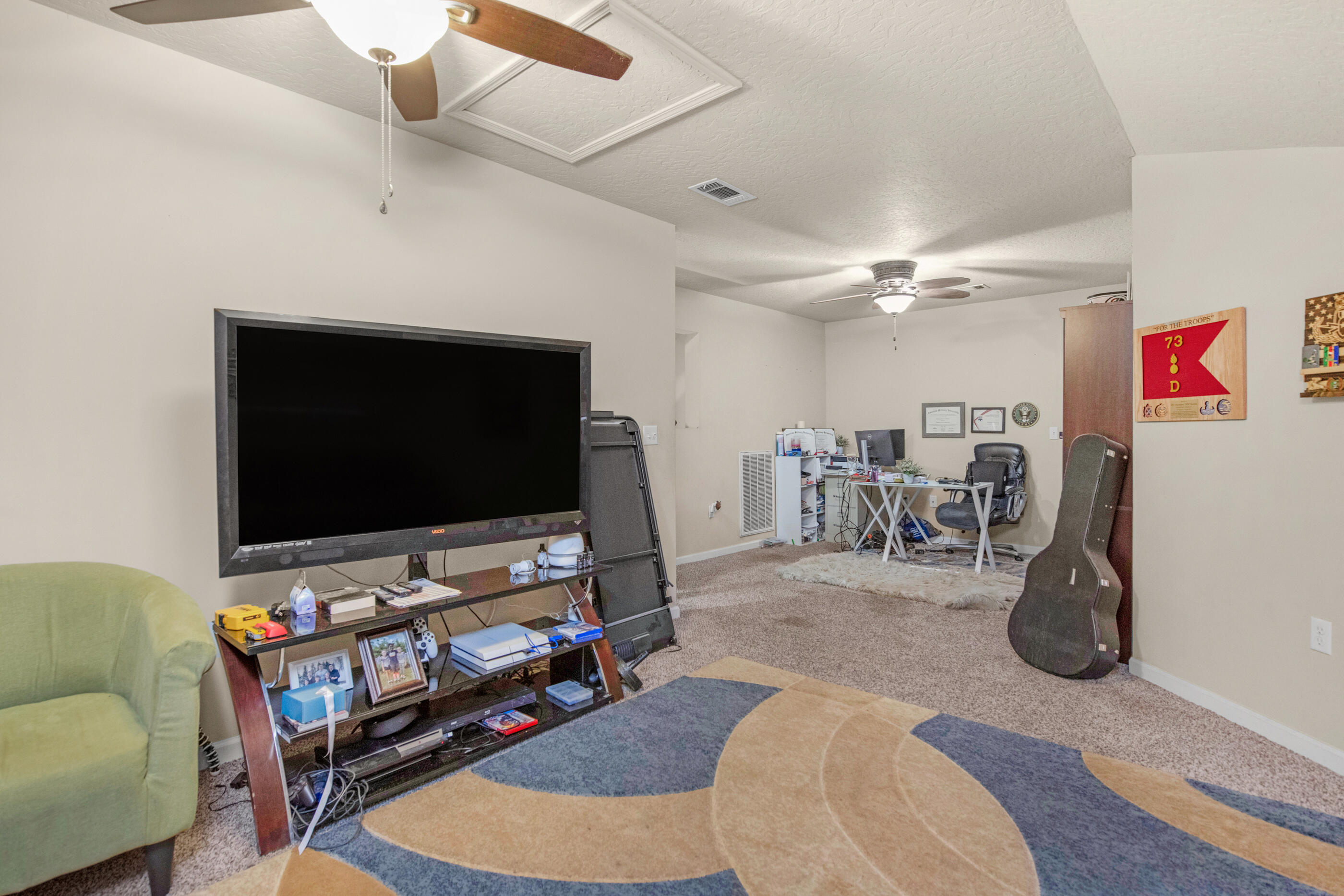 4537 Annabelle Lane Crestview, FL 32539 - Photo 34 of 41 a living room with furniture and a flat screen tv