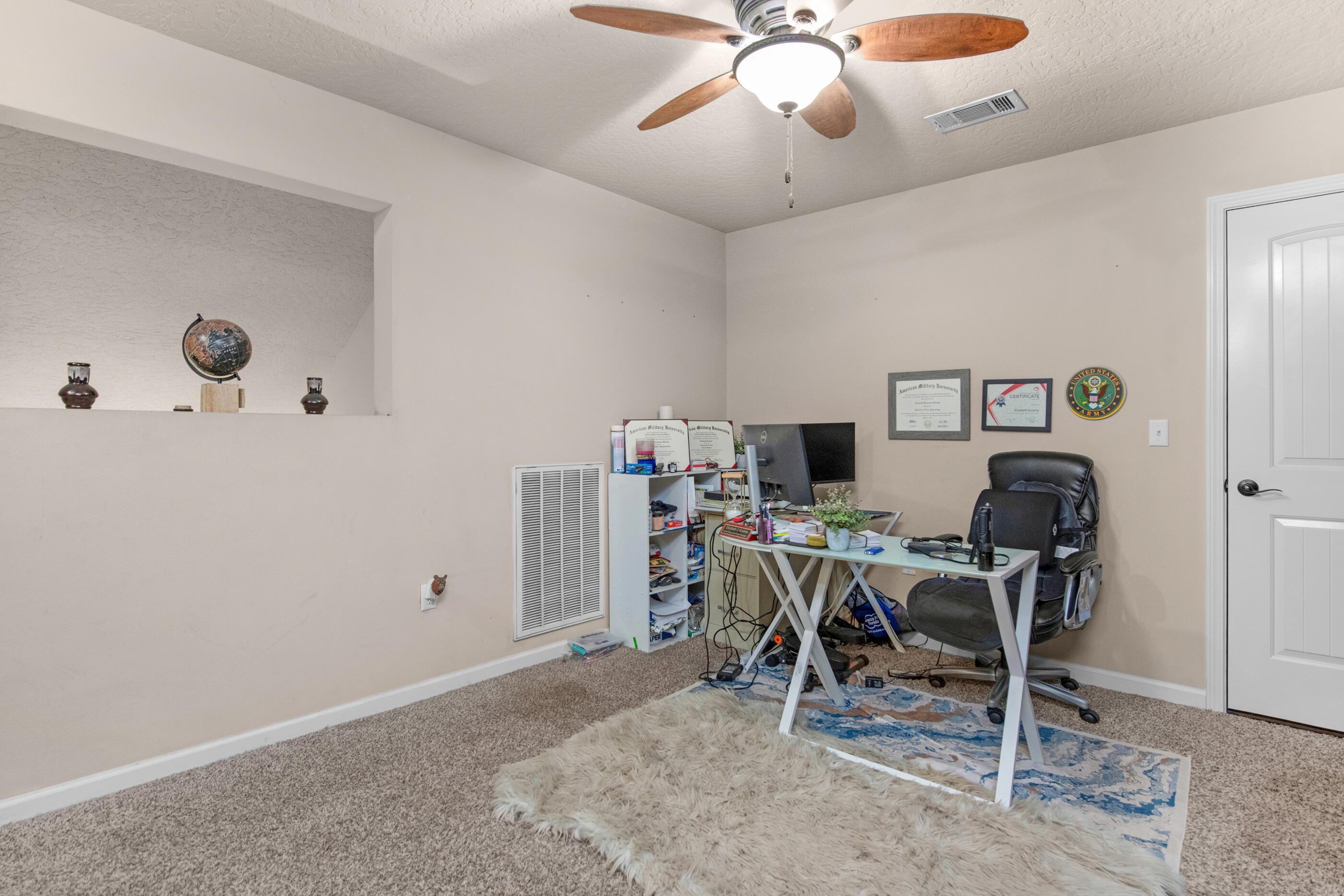 4537 Annabelle Lane Crestview, FL 32539 - Photo 35 of 41 a workspace with a table and chairs