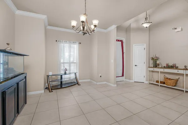 a view of a livingroom with furniture and chandelier