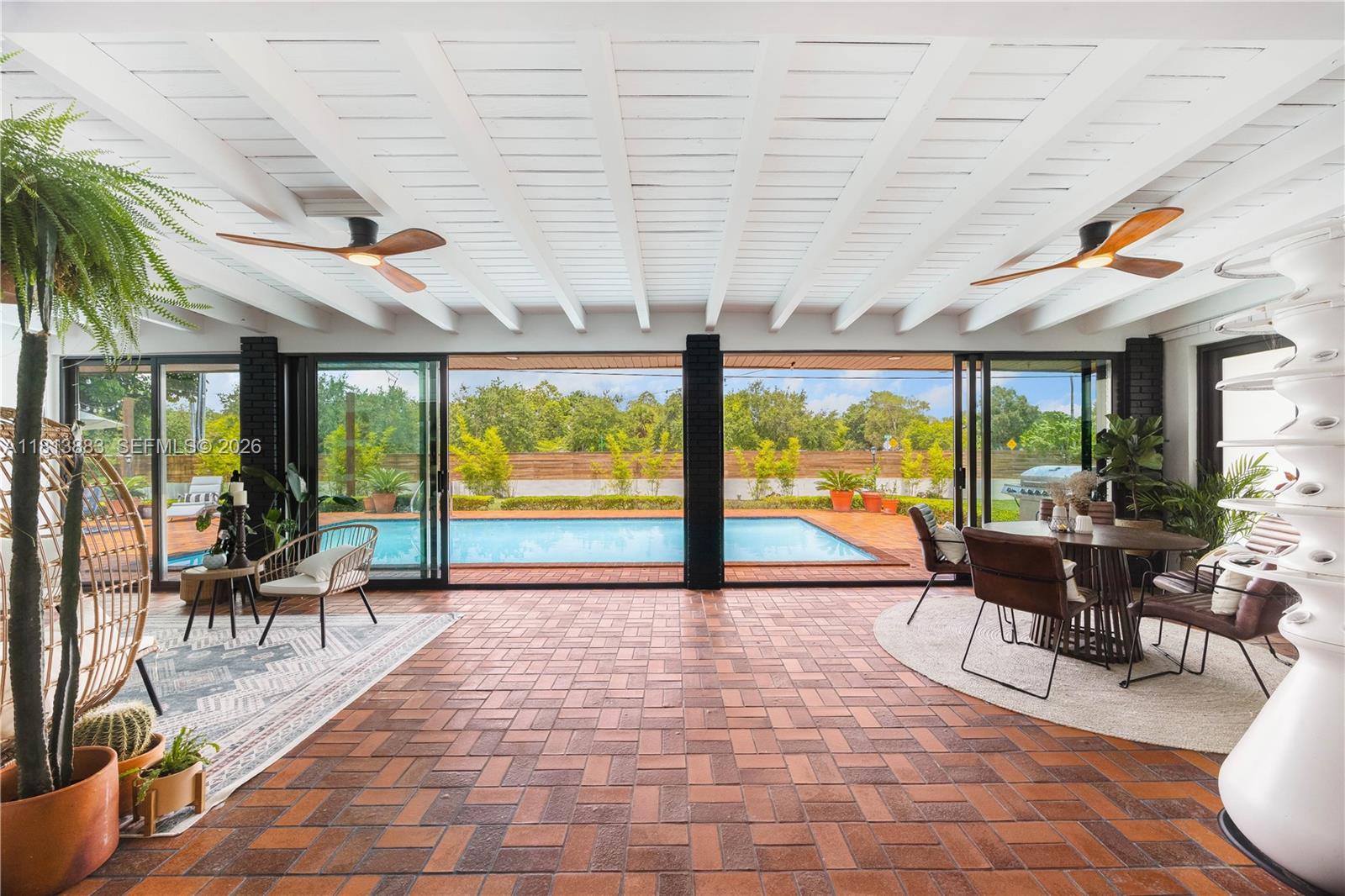 9670 Southwest 96th Court Miami, FL 33176 - Photo 15 of 45 a building outdoor space with furniture and garden view