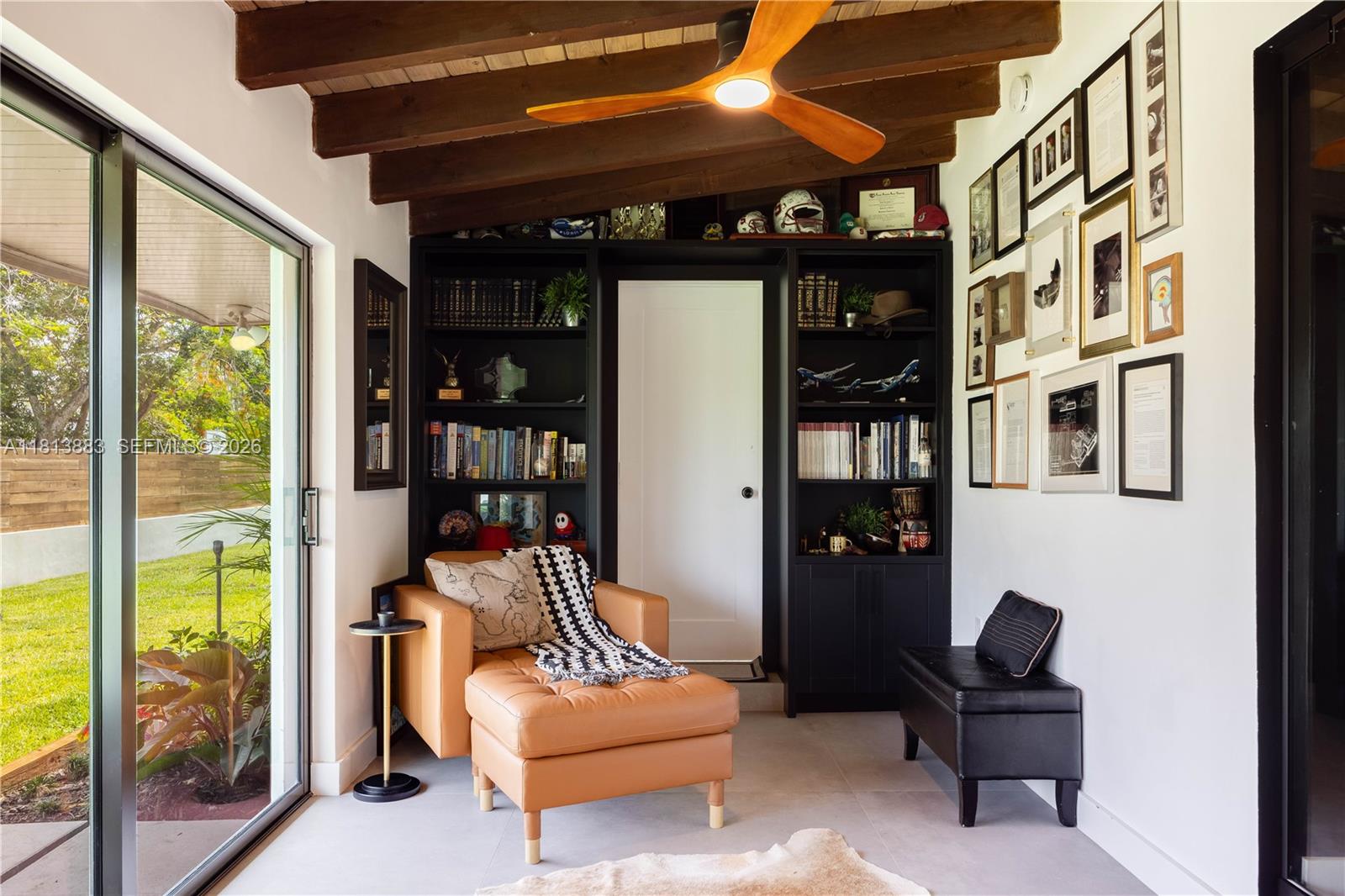 9670 Southwest 96th Court Miami, FL 33176 - Photo 18 of 45 a living room with furniture and a floor to ceiling window