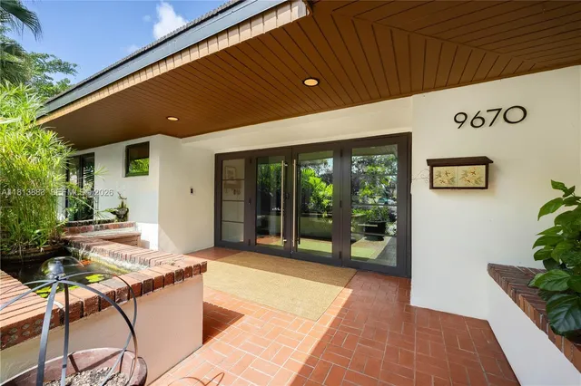 a kitchen with stainless steel appliances kitchen island granite countertop a stove and a refrigerator