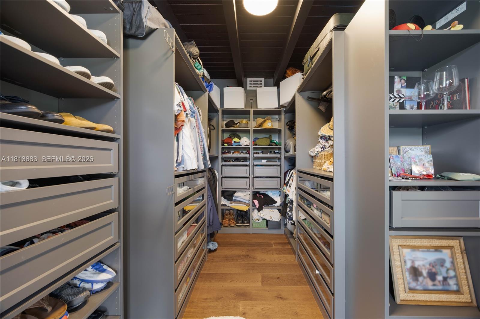 9670 Southwest 96th Court Miami, FL 33176 - Photo 22 of 45 a view of walk in closet with clothes and shoes