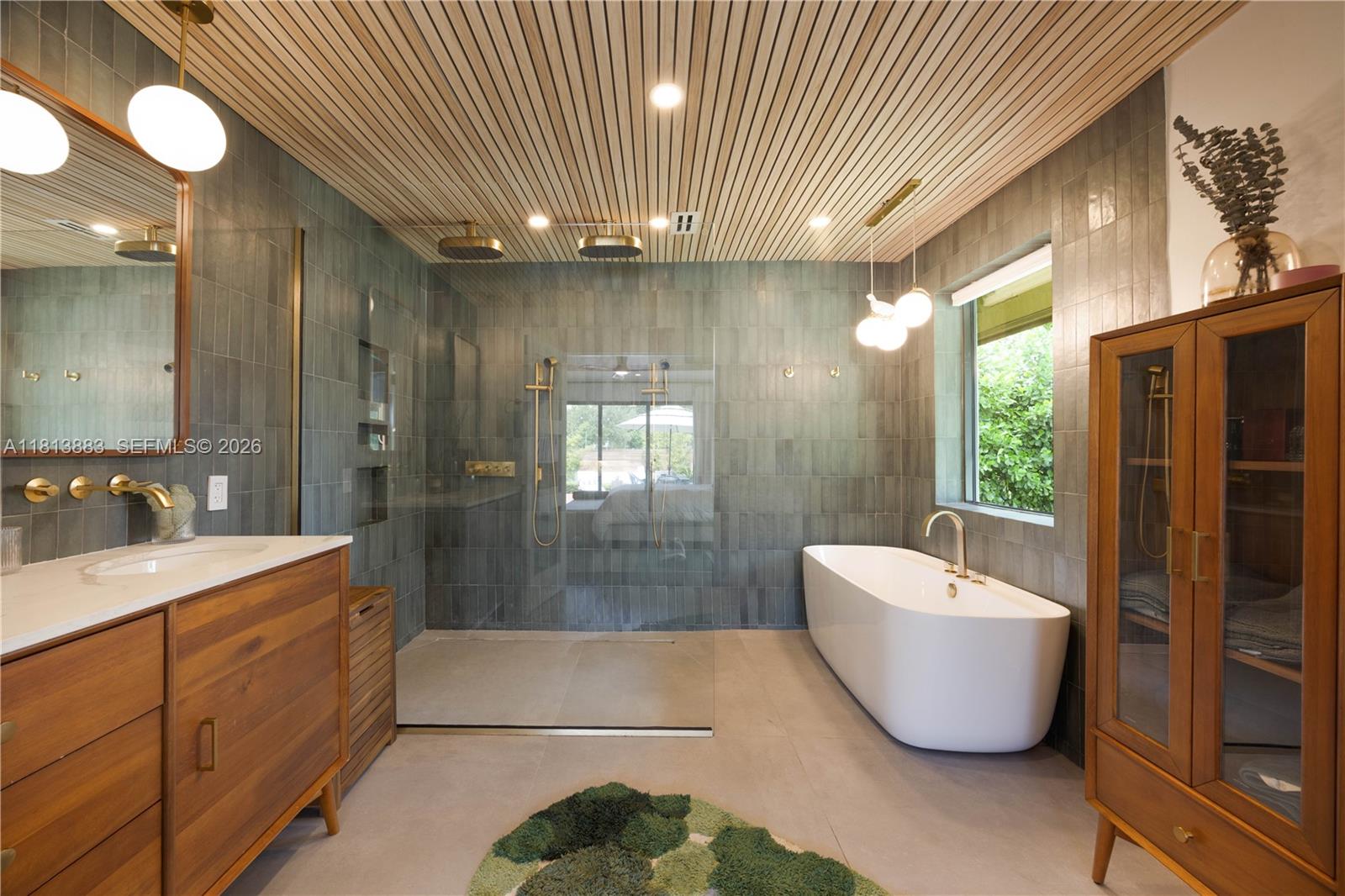 9670 Southwest 96th Court Miami, FL 33176 - Photo 24 of 45 a bathroom with a bathtub and shower