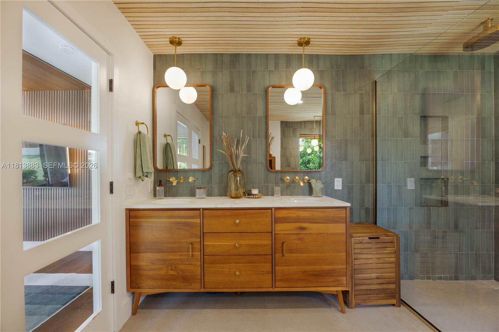 9670 Southwest 96th Court Miami, FL 33176 - Photo 24 of 45 a view of a bathroom with a granite countertop sink a light fixture and a mirror