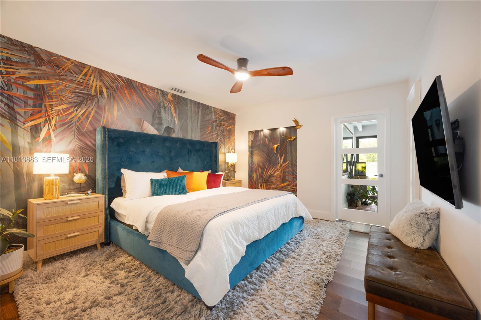 9670 Southwest 96th Court Miami, FL 33176 - Photo 25 of 45 a bedroom with a large bed and a flat tv screen