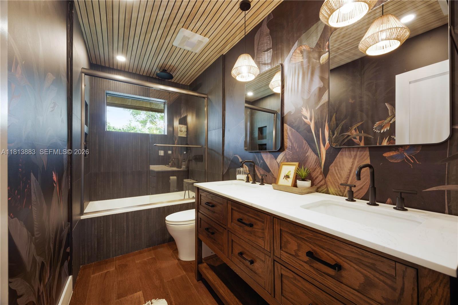 9670 Southwest 96th Court Miami, FL 33176 - Photo 27 of 45 a bathroom with a double vanity sink and a mirror