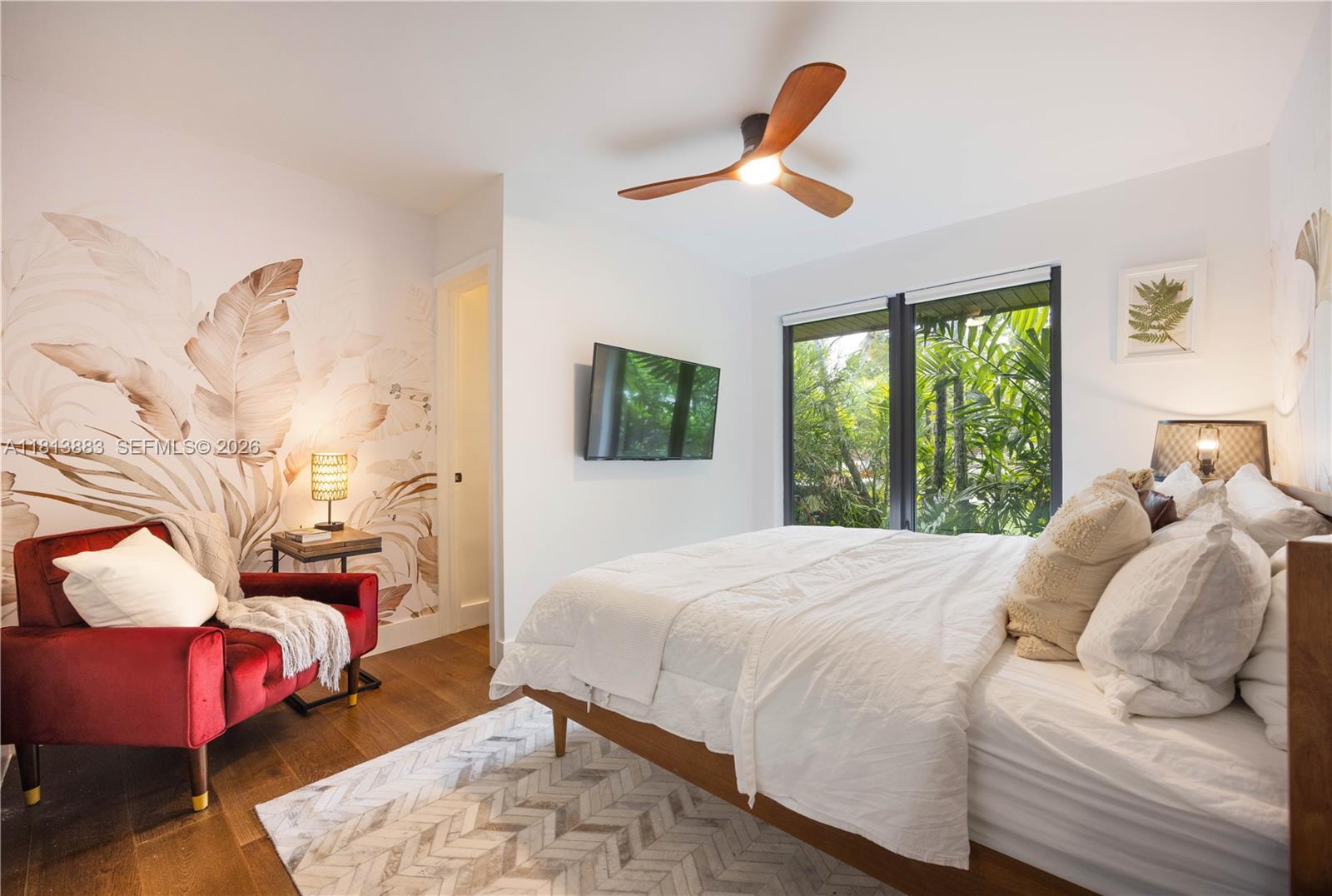 9670 Southwest 96th Court Miami, FL 33176 - Photo 27 of 45 a bedroom with a bed and wooden floor