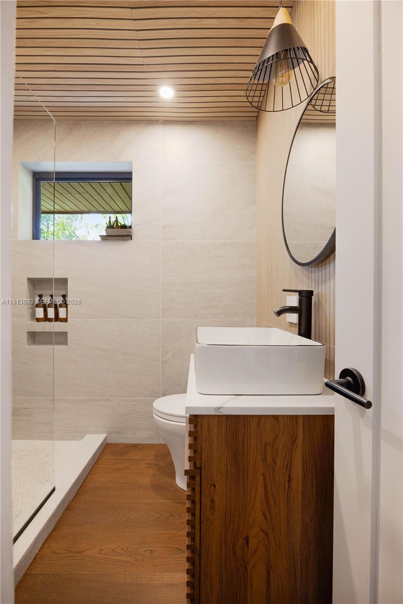 9670 Southwest 96th Court Miami, FL 33176 - Photo 28 of 45 a bathroom with a sink and a mirror