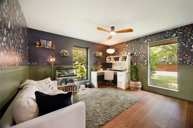 a view of a patio with a table chairs and backyard