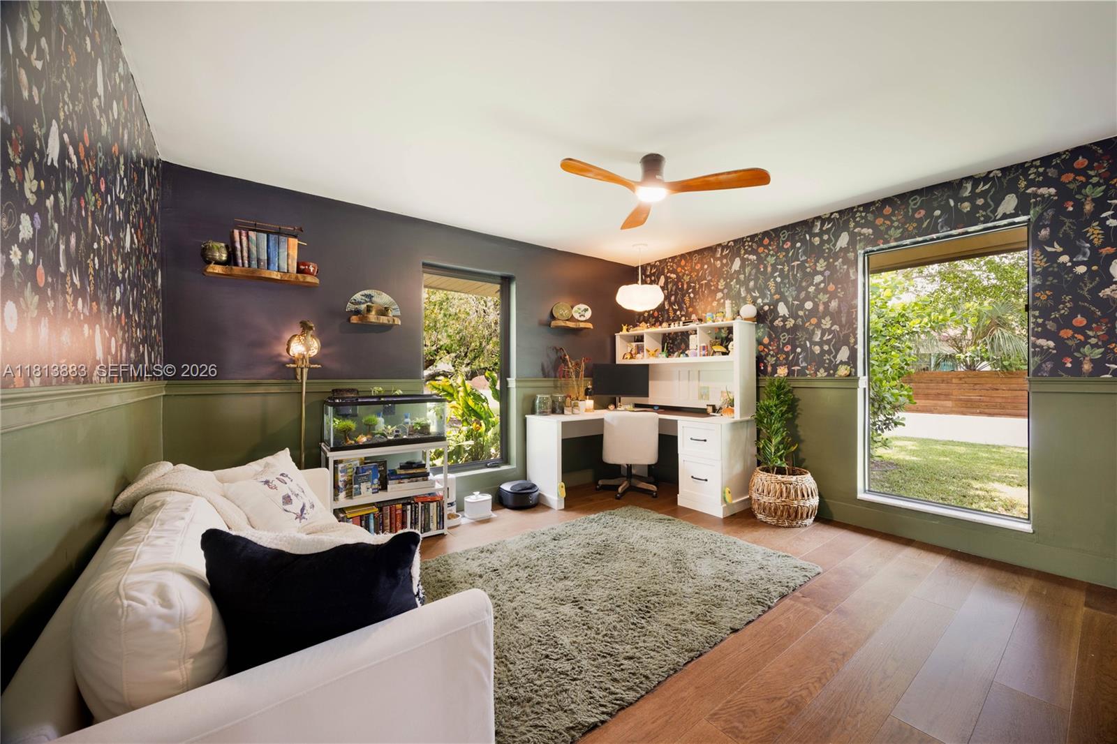 9670 Southwest 96th Court Miami, FL 33176 - Photo 29 of 45 a bed room with furniture and a fireplace