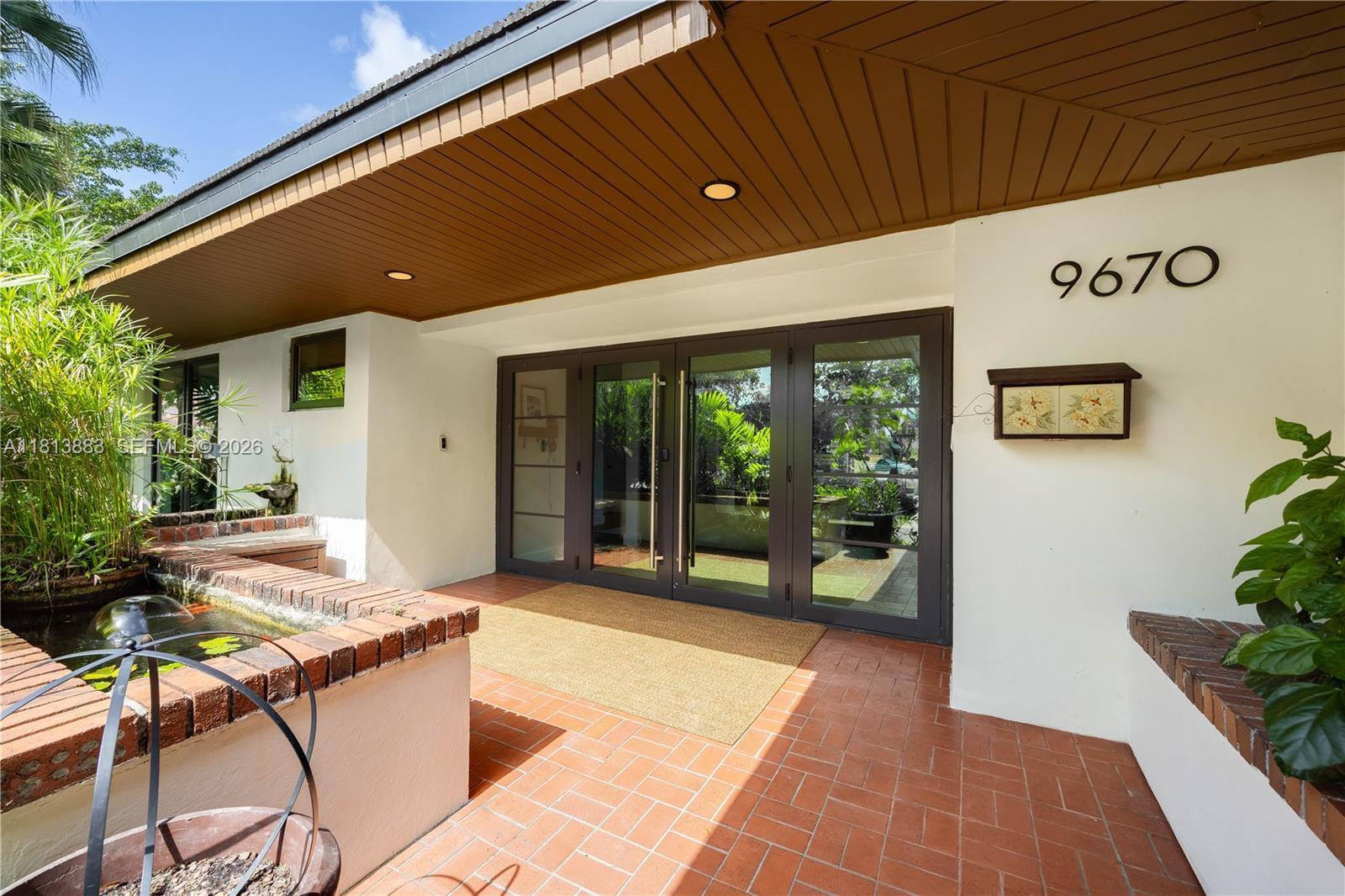 9670 Southwest 96th Court Miami, FL 33176 - Photo 3 of 45 a backyard with furniture and garden